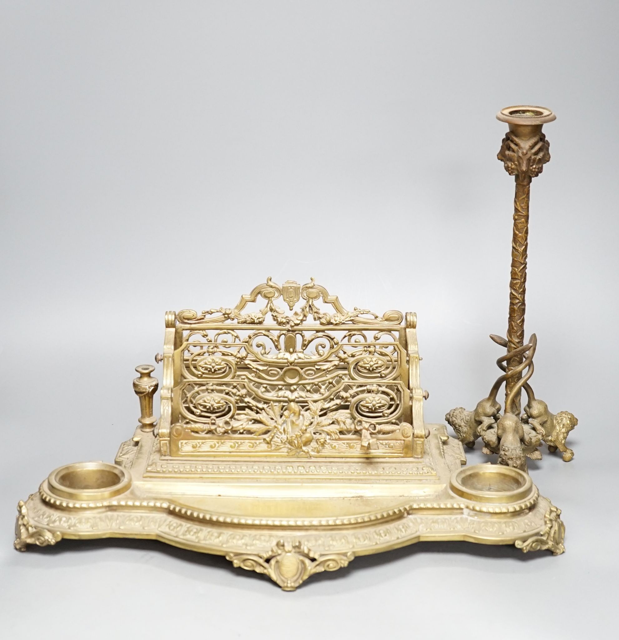 A 19th century bronze desk stand and a similar ‘rams head’ and ‘lion’ candlestick, height 33cm